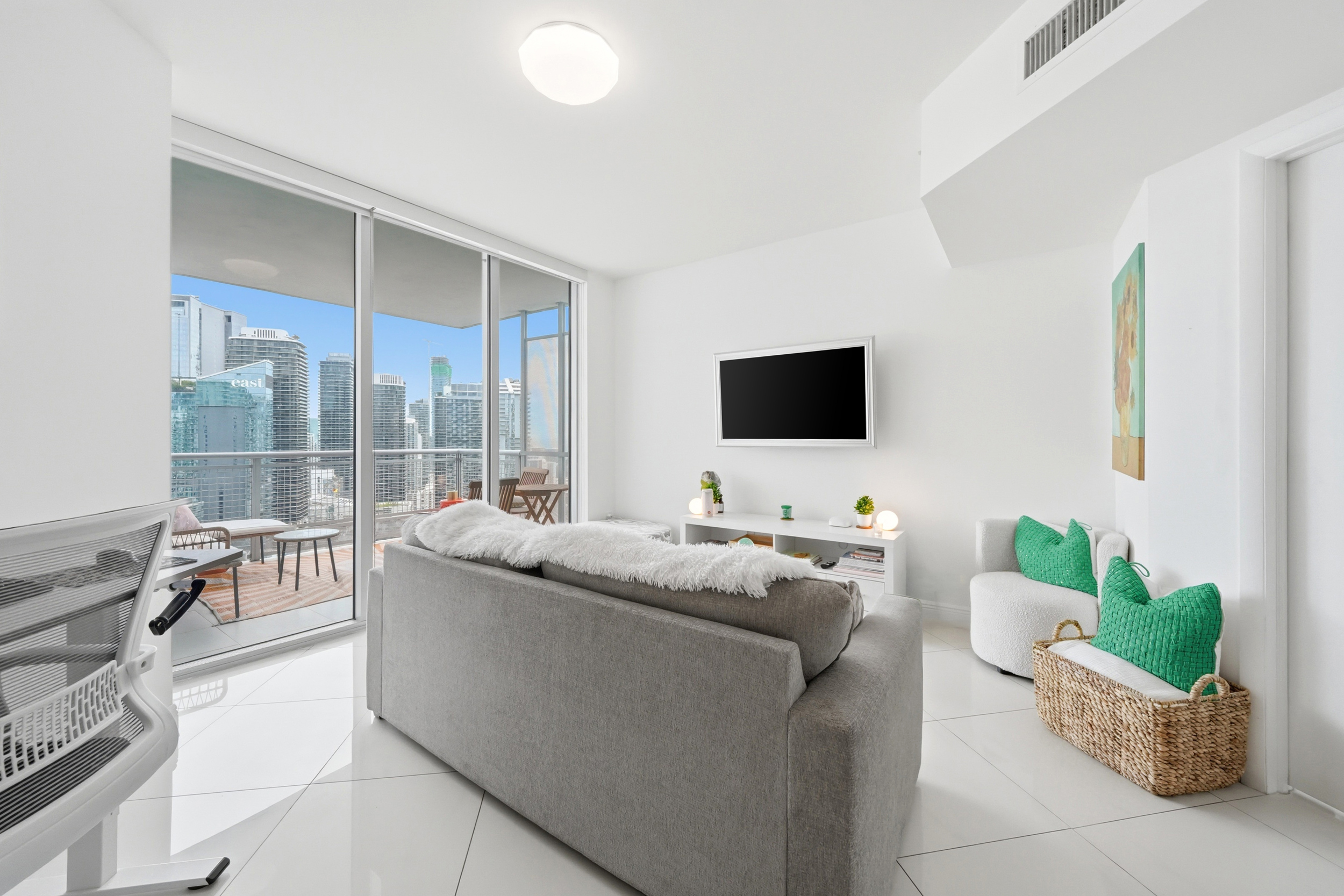 Living room with city views — 39th floor Wind Condo Miami