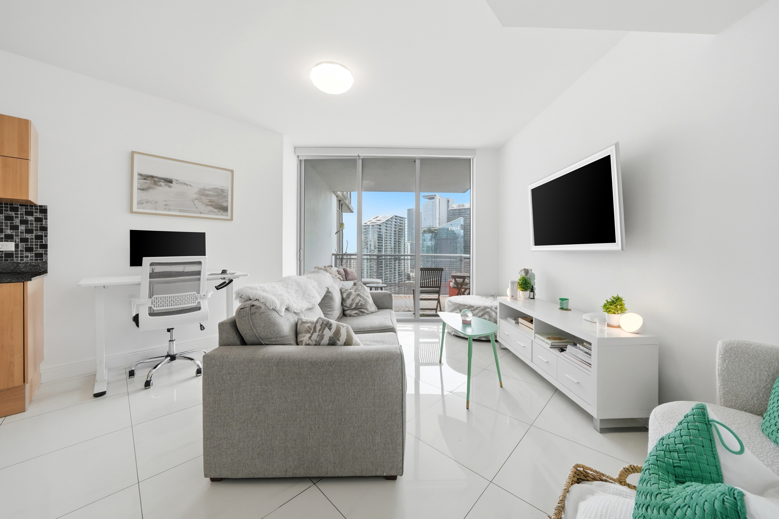 Living room with skyline backdrop — Wind Condo Brickell