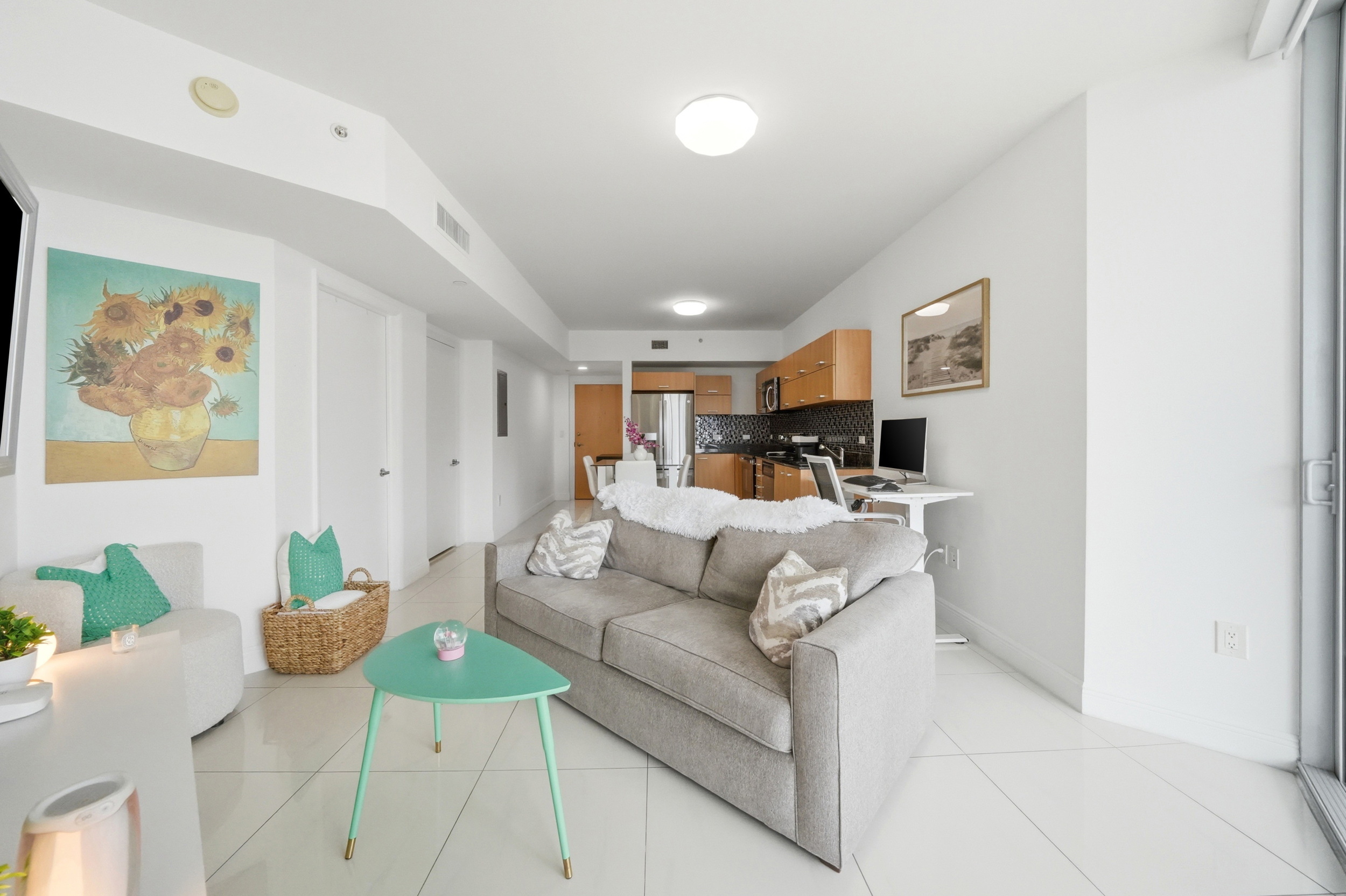 Bright living room with floor-to-ceiling windows — Wind Condo Brickell